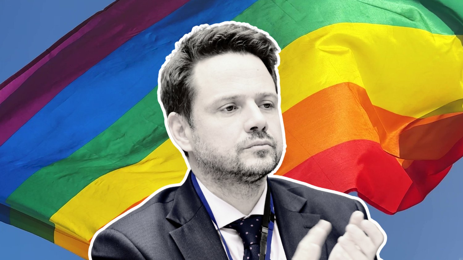 Rafał Trzaskowski na tle flagi LGBT