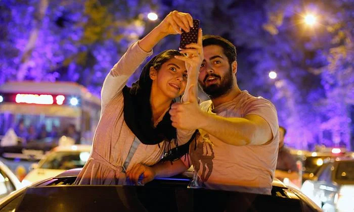 Iranians celebrate in the streets of Tehran after nuclear talks. Photograph: Abedin Taherkenareh/EPA