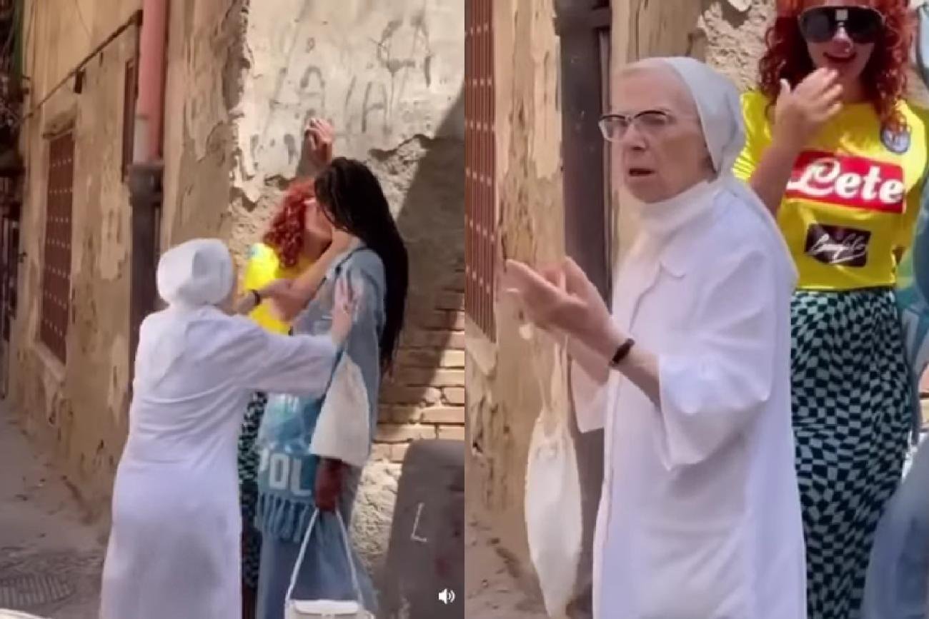 Zakonnica rozdziela całujące się dziewczyny.