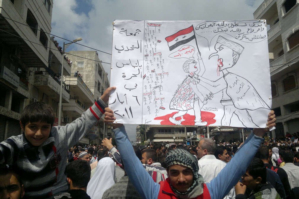 Syryjczycy podczas protestów przeciwko reżimowi Baszara al-Assada.