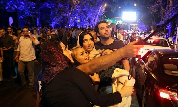 Iranians celebrate the nuclear agreement in Tehran. Photograph: Ahmad Halabisaz/Ahmad Halabisaz/Xinhua Press/Corbis