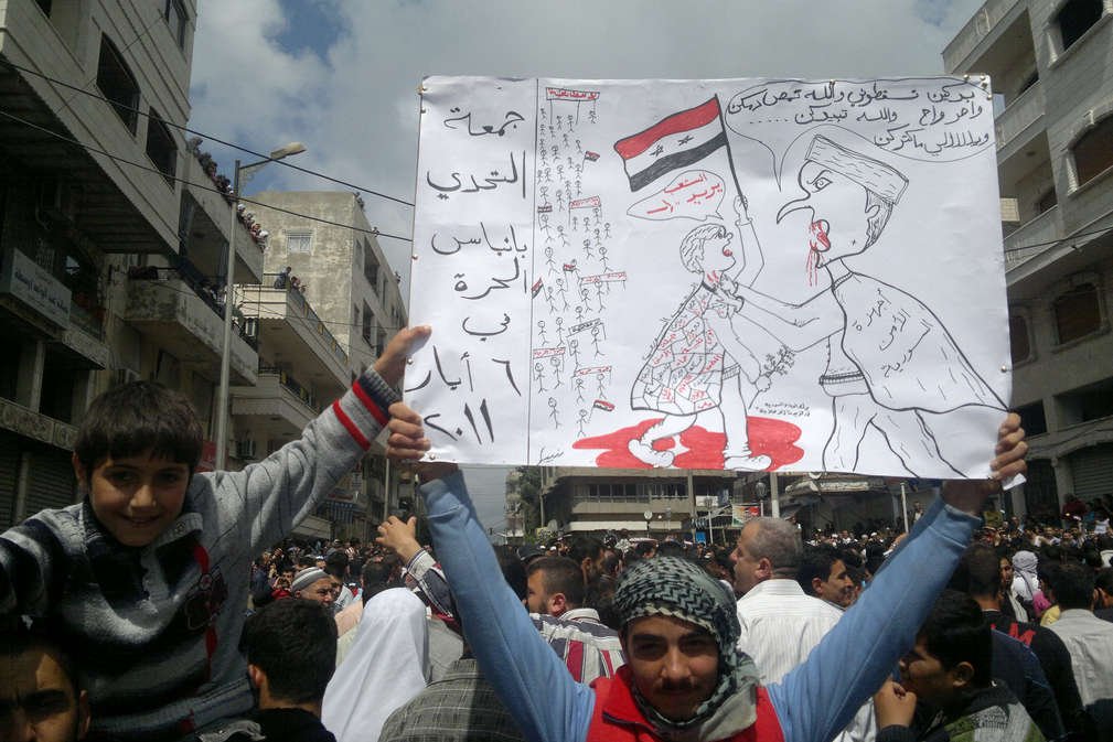 Syryjczycy protestujący przeciwko reżimowi Baszara Al-Assada.