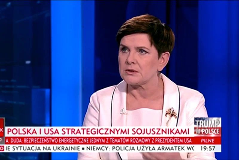 Premier Beata Szydło wyjaśniła w publicznej telewizji dlaczego Donald Trump leci do Polski.