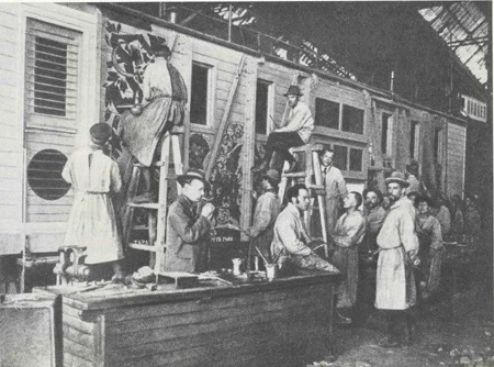 Artists painting a wagon, 1920