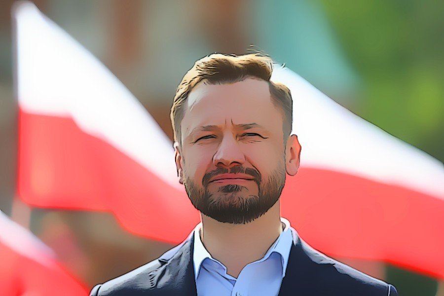 Aleksander Miszalski, prezydent-elekt Krakowa. Aleksander Miszalski, prezydent-elekt Krakowa, na tle polskich flag.