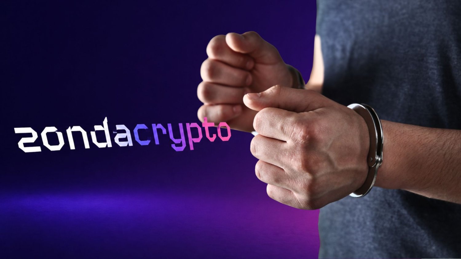 napis "zondacrypto", mężczyzna w kajdankach