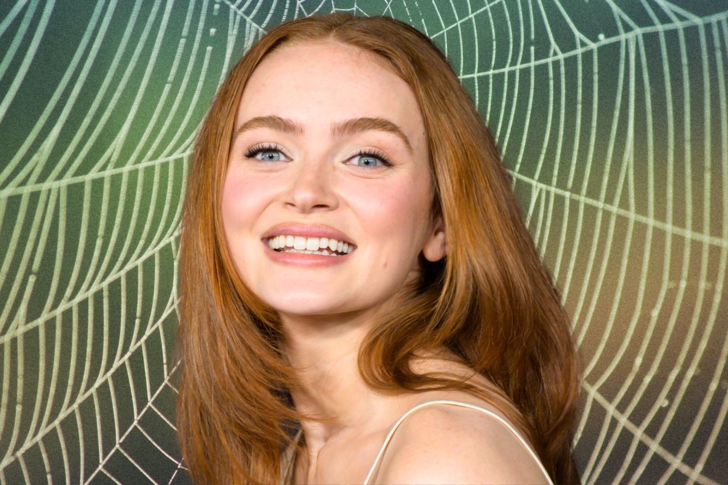 Sadie Sink na tle pajęczyny